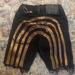 Levi’s with gold rainbows painted on back girls 4-5